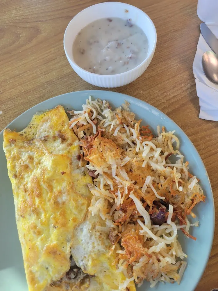 Cheese and Sausage Omelette with Hash Browns and a Side of Gravy